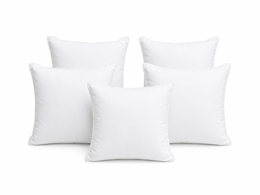 Set of soft white filled cushions