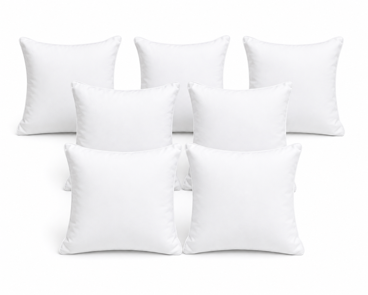 Set of soft white filled cushions — 7 pieces
